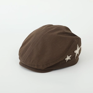 Close-up of retro brown canvas beret featuring white star embroidery and fine stitching