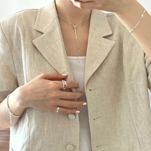 Minimalist 925 sterling silver snake chain jewelry set with necklace and rings on model