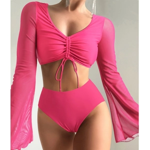Detail of rose pink two-piece swimwear with sheer mesh sleeves and ruched tie-up front design