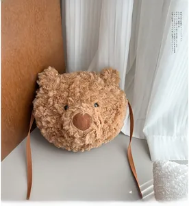 Detailed view of the cute brown teddy bear plush crossbody bag with soft curly faux fur