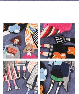 Close-up of colorful cartoon girl embroidered patches on blue denim fabric texture