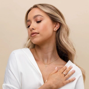 Elegant gold S925 sterling silver cross necklace and matching jewelry set on model