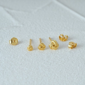 Three sizes of 925 silver knot earrings in matte gold finish with S925 engraved backings