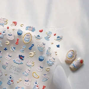 Detail of 3D embossed nail stickers featuring blue cartoon rabbits and fairytale tea party icons