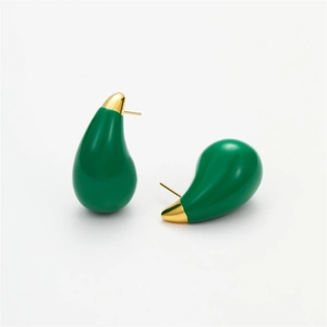 Fashionable green teardrop stud earrings with gold metal top on white background
