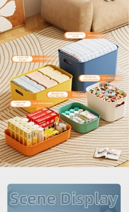 Close-up of colorful storage bins with side handles for organized home closet and toys