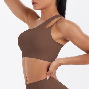 Coffee brown one-shoulder sports bra with asymmetric cutout on white background