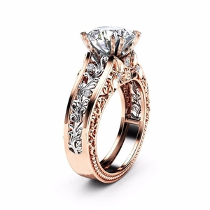 Luxurious two-tone stainless steel ring with crystal diamond and intricate filigree design
