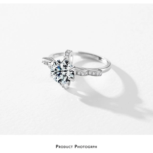 Detail of s925 silver crown ring with six-prong set crystal and wavy pavé diamond band