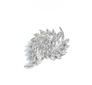 Detailed back view of silver leaf brooch showing metal structure and pin fastener