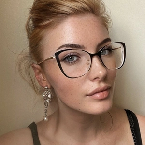 Classic black and gold cat-eye glasses frame with elegant rhinestone tassel earrings