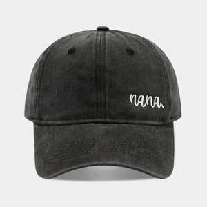 Close-up of nana embroidery on vintage washed cotton baseball cap with ventilation eyelets