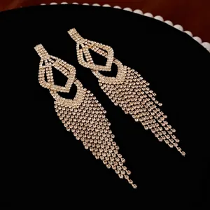 Elegant silver-plated hollow water drop tassel earrings with sparkling rhinestones for gala wear