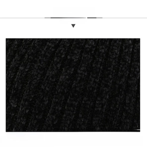 Close-up of black chenille knit fabric showing soft texture and vertical ribbing details