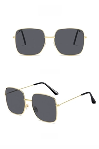 Front and side views of vintage oversized square metal sunglasses with gold frame and gray lenses