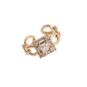 Detail of gold chain-style ring featuring a large square zircon and four small stones