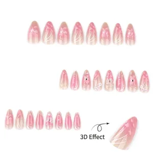 Short almond press-on nails with 3D floral accents, pearls, and pink gradient finish