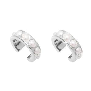 Detail of silver C-shape ear cuff with white pearls in a minimalist elegant design