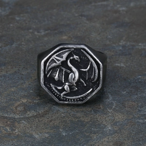 Macro shot of an octagonal vintage dragon ring with engraved relief in antique silver finish