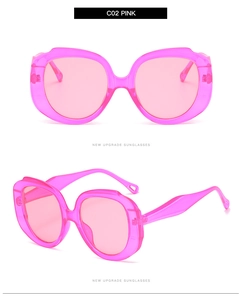 Detail view of pink round oversized sunglasses with matching frames and lenses