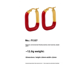 Detail view of red enamel and gold plated stainless steel geometric earrings with dimensions