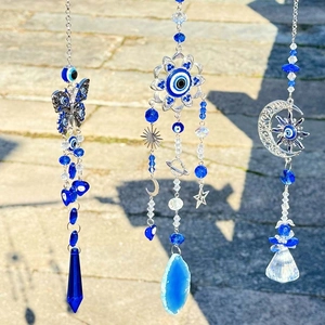 Blue Evil Eye butterfly suncatcher with crystal pendants for garden and wedding decor