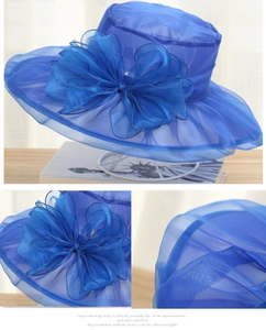 Detail of royal blue organza sun hat with large bow and breathable mesh fabric