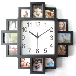 Detail of creative black wooden photo frame wall clock with eight picture slots