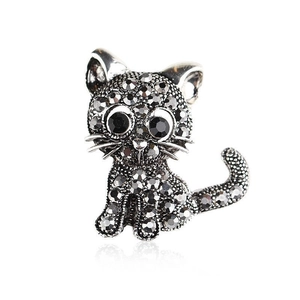 Elegant vintage kitten brooch with grey and black rhinestones on a silver alloy base