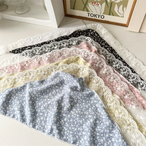 Close-up of assorted floral print headscarves with delicate lace trim edging