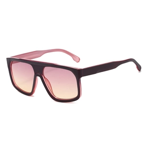Futuristic oversized square sunglasses with burgundy frame and orange gradient lenses