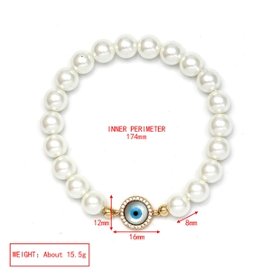 Detail view of pearl Evil Eye bracelet with dimensions 174mm inner perimeter and 16mm pendant
