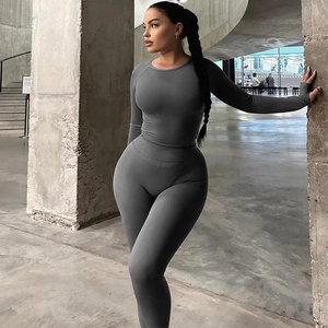 Deep grey yoga set featuring long sleeve crew neck top and high waist leggings