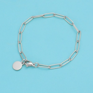 Detailed view of silver stainless steel paperclip chain bracelet with a round charm
