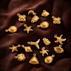 Selection of 18K gold plated stainless steel charms in heart and shell shapes