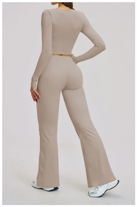 Detail view of v-shaped high waist yoga pants and back of long sleeve crop top in beige