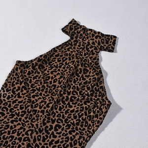 Close-up of leopard print mesh fabric detail on the high neck mesh bodysuit