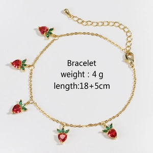 Detail of strawberry charm bracelet with red zircons, 18+5cm adjustable gold chain