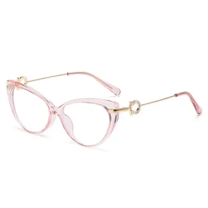 Cat eye glasses with transparent pink TR90 frames and gold metal diamond studded temples