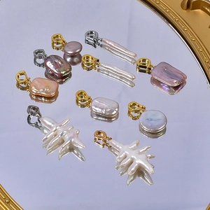 Baroque natural freshwater pearl pendants in pink, purple, and white on gold mirror
