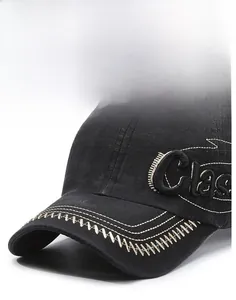 Detailed view of black washed cotton baseball cap with white contrast stitching and embroidery