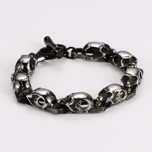 Close-up of gothic skull bracelet with silver antique finish and punk OT toggle clasp