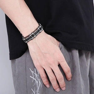 Detail of masculine titanium steel wire bracelet with industrial black and silver finish