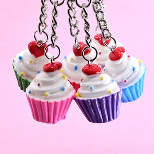 Cute heart cupcake keychain pendants with colorful paper cups and decorative sprinkles