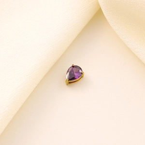 Detail of purple pear-shaped gemstone pendant with gold-plated three-claw setting
