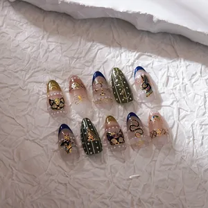 Detailed macro view of Ancient Egyptian style nail art with gold relief and pharaoh motifs