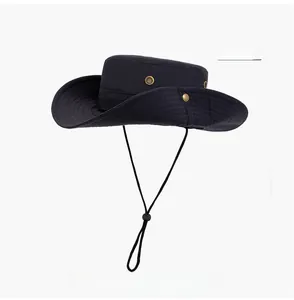 Detail of navy blue sun hat with metal eyelets, snap buttons and adjustable wind cord