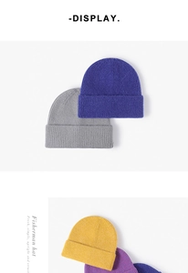 Close-up of ribbed knit texture on colorful fisherman hats in blue, grey and yellow
