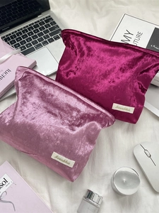 Pink and purple velvet makeup bags for travel, showing large capacity and soft texture