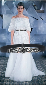 Detail of black elastic waist belt with sparkling crystal rhinestone buckle and model view